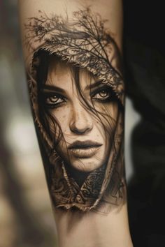 A realistic tattoo of a woman's face with detailed shading and a floral design around her hood. Womens Viking Tattoos, Female Viking Tattoo Ideas, Viking Woman Tattoo Female Warriors, Women’s Viking Tattoos, Female Viking Tattoo, Viking Lady Tattoo, Timeless Tattoo, Landscape Tattoo, Geometric Symbols