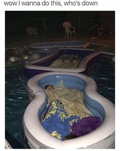 an inflatable pool with two people laying on it and one person sleeping inside