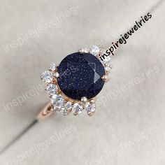 Blue Sandstone Ring- Round Cut Ring- Galaxy Ring- Outer Space Ring- Nebula Ring- Bridal Ring- Solitaire Sandstone Ring- Promise Ring- IJ --->Ring details: - Theme: Solitaire & Engagement - Metal Type: Sterling Silver, White Gold, Rose Gold , Yellow Gold - Main Stone: Blue Sandstone - Accented stones: Cubic Zircons - Color: Blue, White - Ring Size: I offer more than one (Contact us if your ring size is not available in the listing) - Gemstone Size:- Main Stone: 8 mm -100 % Handmade -100% Original Sapphire Rings With Accent Stones For Party, Sapphire Crystal Ring With Gemstone Accents, Round Birthstone Ring For Party, Birthstone Ring For Party, Celestial Round Jewelry For Parties, Party Rings With Stones, Celestial Blue Rings With Accent Stones, Blue Goldstone Engagement Ring, Blue Sandstone Engagement Ring