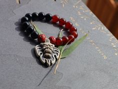 Exciting mixed Red/ black agate joined Demon Head. Excellent workmanship & detail. Lots of hand work in this design. supernatural entity Chakra Points, Spiritual Protection, Tiger Eye Stone, Red Agate, Unique Bracelets