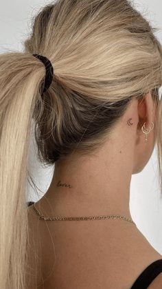 14 Unique and Creative Behind-the-Ear Tattoos Dainty Back Neck Tattoo, Tiny Tattoos Neck, Dainty Back Of Neck Tattoo, Dainty Back Of Neck Tattoos For Women, Back Of Neck Tattoos For Women Classy, Nape Of Neck Tattoo For Women, Pretty Tattoo Placement, Dainty Neck Tattoos, Tiny Neck Tattoos For Women