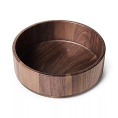 a wooden bowl on a white background