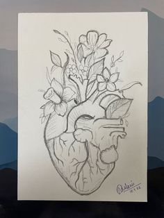 a drawing of a heart with flowers in it