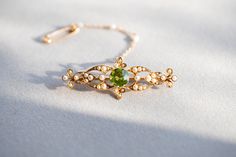 Edwardian peridot and seed pearl bar brooch. VIDEO https://youtu.be/2dqmfwkwrfE https://youtu.be/LcAQcLa-tuE DETAILS 15 carat yellow gold. Brooch width 5cm, length 2cm, weight 5.2g. CONDITION REPORT Pre-owned,  Overall condition excellent  HALLMARKS: tbc LIKE IT? Make a perfect vintage GIFT!  All our jewellery comes beautifully packed in one of the Kashovska Vintage Collection original boxes. However if you would like to pair your vintage pendant with an authentic antique box you can some amazin Antique Boxes, Green Gemstones, Vintage Jewellery, Vintage Gifts, Gifts For Wife, Gemstone Jewelry, Jewelry Accessories, Accessory Gift, Gemstones