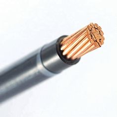 a close up view of an electrical wire with copper colored wires in the center and on the outside