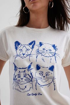 Purrrfect graphic tee featuring a graphic of four cats across the front. Designed in a slim fit & cropped length for an effortless look. Only at Urban Outfitters. Features Cat Lady Era slim graphic tee Fitted graphic tee Soft and stretchy knit Crew neckline and short sleeves Four cats and Cat Lady Era graphic across the front Slim fit Cropped length Easy pull-over style UO exclusive Content + Care 100% Cotton Machine wash Imported Size + Fit Model in White is 5’9.5" and wearing size Small Measur Singapore Outfit, Four Cats, Top Graphic Tees, Women Men Shoes, Tees For Women, Jeans For Sale, Cat Lady, Tee Shop, Women's Style