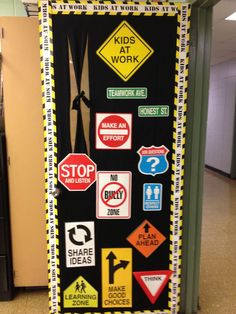 a bulletin board with various road signs on it