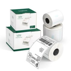 three rolls of toilet paper sitting next to each other on top of two boxes with the same roll in front of them