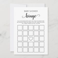 a baby shower game card with the words'baby shower bingo'in cursive font