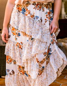 Beautiful & Timeless Floral print mixed, midi skirt featuring waist elastic, ruffle detailed, asymmetrical 100% Polyester Imported Measurements Approx.1X- Waist: 34" Hips: 54" Inseam: 36.5"2X- Waist: 36" Hips: 56" Inseam: 36.5"3X- Waist: 38" Hips: 58" Inseam: 36.5"