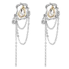 Turn heads in these two tone drop earrings offering sparkling embellishment, abstract framing and delicate chains that suspend below. 0.7" W x 3.03" L Silver-plated copper / 18k gold-plated copper / cubic zirconia / crystal Silver Dangle Earrings With Gold Chain, Chain Drop Earrings, Metal Heart, Heart Shape, Heart Shapes, Two Tone, Cubic Zirconia, Tassels, 18k Gold