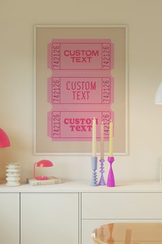 a table with some candles on top of it next to a wall mounted movie ticket