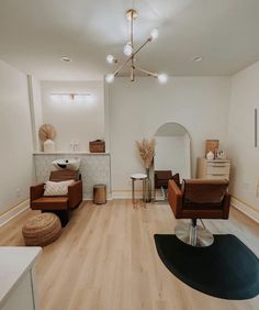 a living room filled with furniture and wooden floors