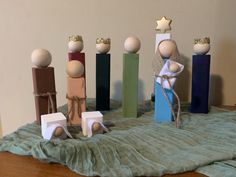 a group of wooden toys sitting on top of a table