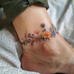 Wildflower Tattoo Master Files – IMAGELLA Anklet Tattoos For Women Wrap Around, Wild Flower Bracelet Tattoo, Wildflower Armband Tattoo, Birth Flower Arm Band Tattoo, Wildflower Bee Tattoo, Low Back Flower Tattoo, Fun Color Tattoos, Ankle Tattoos For Women Flower, Bee Balm Tattoo