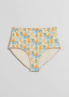 High waist bikini bottoms featuring an all-over floral pattern. Stretch Floral Print Bottoms For Pool, Floral Print Stretch Bottoms For Pool, Multicolor Floral Print Bottoms For Sunbathing, Beach Stretch Bottoms With Floral Print, High Waist Floral Print Swimwear For Sunbathing, Stretch Floral Print Beach Bottoms, Floral Print Fitted Bottoms For Poolside, Poolside Floral Print Fitted Bottoms, High Waist Floral Print Swimwear For Swimming