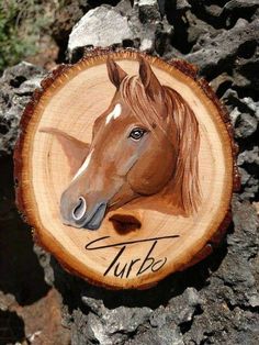 a wooden sign with a horse on it's face and the words turke written in cursive writing