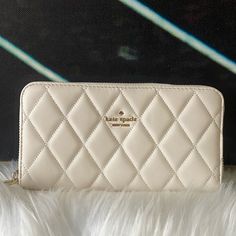 Nwt Kate Spade Quilted Long White Wallet Details Smooth Quilted Leather Two Way Spade Jacquard 3.9" H X 7.7" W Ksny Metal Pinmount Logo Zip Closure 12 Credit Card Slots 2 Internal Slip Pockets Center Divider Cetner Zip Coin Compartment Slip Pocket On Back Dust Bag Not Included Imported Style #Wlru6340 Luxury White Wallets With Interior Card Slots, Elegant Cream Wallet For Everyday Use, Elegant Cream Wallets For Everyday Use, White Kate Spade Wallet For Everyday Use, Kate Spade White Leather Wallet, White Clutch With Card Slots, Elegant Cream Leather Wallet, White Kate Spade Bags With Card Slots, White Rectangular Kate Spade Wallet