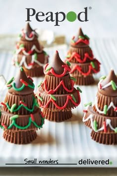 small christmas trees made out of chocolate on a white plate with the words peaood