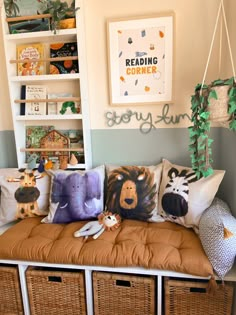 some stuffed animals are sitting on a bench in front of bookshelves and baskets