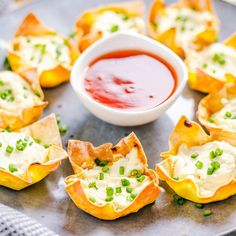 small appetizers on a plate with dipping sauce