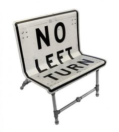 there is a sign that says no left turn on the back of a chair with wheels