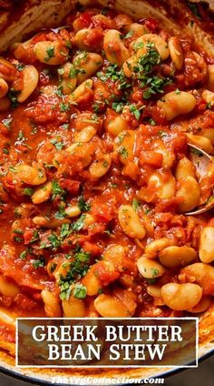 a pot filled with beans and sauce on top of a table