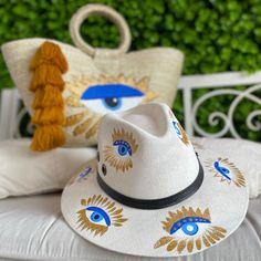 Hand Painted Eye Palm Tote and Hat Set Artisan White Sun Hat For The Beach, Artisan White Sun Hat For Beach, Wide Brim Canvas Sun Hat For The Beach, White Canvas Summer Hat, Artisan White Sun Hat For Vacation, White Hand Painted Hat For Vacation, White Hand Painted Hats For Vacation, Bohemian Hand Painted Straw Hat For Vacation, Bohemian Hand Painted Sun Hat For Vacation