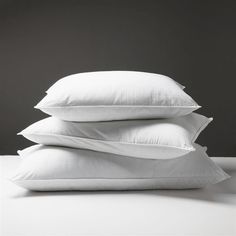 three pillows stacked on top of each other