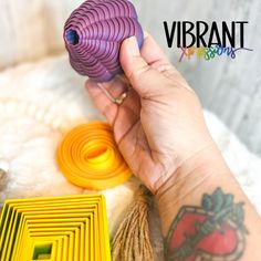 a person is holding an object in their hand with the word vibrant on it