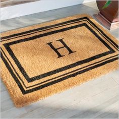 a door mat with the letter h on it