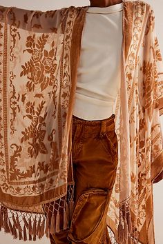 This luxe sheer kimono features a stunning velvet floral print design and fringe hem. **Fit:** Relaxed and oversized **Features:** Open-front design, armholes, side slits, sheer fabrication, velvet floral print, fringe hem **Why We | Nightbird Burnout Kimono by Free People in Tan Boho Mom, Free People Kimono, Fancy Casual, 70s Inspired Fashion, Sheer Kimono, Spring Break Outfit, Free Spirit Style, Floral Print Design, White Lace Top