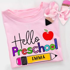 Get ready for the first day of preschool pictures with these adorable personalized school tshirts. These super buttery soft tshirts are 100% Airlume combed and ring-spun cotton jersey with a tear-away label for extra comfort. Choose from white, athletic grey or pink. For personalization: At checkout please write child's name and Pre-K or Preschool. Kindergarten through 5th grade Tshirts also available in Child's sizes S, M, L, XL. .: 100% Airlume combed and ringspun cotton (fiber content may var First Day Of School Shirts Kids, Fun Pink T-shirt For School Events, Playful Pink T-shirt For School, Pink T-shirt With Name Print For School, Pink T-shirt For End Of School Year, Personalized Short Sleeve T-shirt For Back To School, Pink T-shirt For Back To School, Cute T-shirt With Name Print For Teacher Appreciation, Cotton T-shirt For Daycare And Back To School