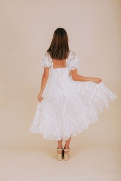 Indulge in a playful afternoon with our EXCLUSIVE Afternoon With You Dress. This white dress features delicate floral accents, puff sleeves, and a corset bodice for a flirty touch. Elastic along the shoulders and cuffs, corset tie back, and invisible zipper closure ensure a comfortable and perfect fit. Complete with ruffle details and a tier hem for a whimsical look. Say yes to this must-have dress! Details *Measurements are taken with item hanging and fabric unstretched.* White dress with white White Square Neck Dress With Broderie Anglaise, White Broderie Anglaise Dress With Square Neck, Swiss Dot Dress For Spring Garden Party, Spring Swiss Dot Dress For Garden Party, White Broderie Anglaise Midi Dress For Brunch, White Swiss Dot Dresses For Spring, White Puff Sleeve Dress For Garden Party, White Puff Sleeve Dress For Summer Wedding, White Knee-length Puff Sleeve Dress For Garden Party