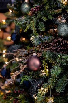 a christmas tree with ornaments and lights on it