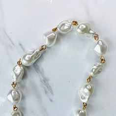 Shimmering glass baroque pearls lend elegance and a unique layer to your stack, pair them with other pearls, gold chains or wear solo. Adjustable length, lobster clasp closure, measures 20” long. Free from cadmium, lead, and nickel. Choose from gold or silver. Pearl Beaded Necklace, Custom Jewelry Design, Baroque Pearls, Jewelry Designs, Pearl Beads, Custom Jewelry, Gold Chains, Silver Color, Lobster Clasp