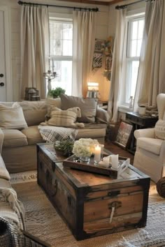 a living room filled with furniture and windows