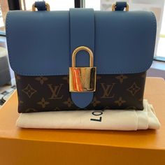 Louis Vuitton Handbags Monogram Lock Bb Blue Dustbag No Box High-end Blue Box Bag For Everyday Use, Designer Travel Shoulder Bag With Lock, Designer Shoulder Bag With Lock For Travel, Blue Bags With Lock For Formal Occasions, High-end Blue Box Bag For Shopping, Blue Leather Bag With Lock, Luxury Blue Flap Bag With Gold-tone Hardware, Luxury Blue Flap Bag With Detachable Handle, Luxury Blue Flap Bag For Travel