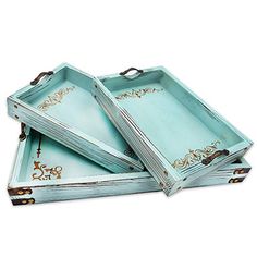 three blue trays sitting on top of each other