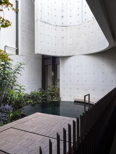 an indoor swimming pool in front of a white building