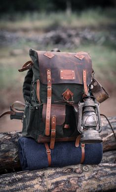 Materials ▪️ 100% cotton, water resistant waxed canvas and Genuine Leather ▫️Wide and deep flasks on the right and left ▪️550 Lb parachute rope as tension straps on the flask ▫️Leather hanger for hanging knives and axes on both sides ▪️Two front pockets ▫️Axe hanger with buckle between front pockets ▪️ Foam padded shoulder straps and back ▫️Hip Belt: By giving some of the weight from the shoulders to the hip bone, it prevents the shoulders from getting sore in a short time and provides a more co Leather Hanger, Camping Bags, Bushcraft Backpack, Backpack Ideas, Camping Products, Digital Payment, Backpack Camping, Adventure Bags, Waxed Canvas Backpack