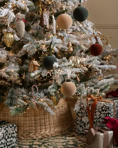 a decorated christmas tree with presents under it