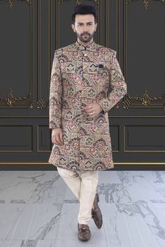 This multi-color sherwani for men is a versatile addition to any wardrobe. Crafted with precision, its unique design showcases expert tailoring and a blend of vibrant colors, making it perfect for any occasion. Express your personal style with confidence and make a statement wherever you go. Multicolor Traditional Bandhgala For Designer Wear, Elegant Multicolor Kurta With Pallu, Traditional Multicolor Bandhgala For Wedding, Multicolor Designer Sherwani For Diwali, Designer Multicolor Naqshi Kurta, Multicolor Ceremonial Bandhgala For Festive Occasions, Designer Multicolor Bandhgala With Zari Work, Multicolor Unstitched Sets For Formal Occasions, Multicolor Bandhgala For Ceremonial And Festive Occasions