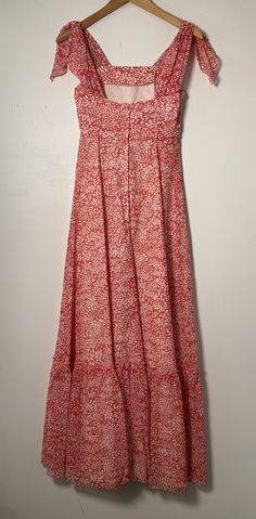 This floral maxi dress is the stuff of dreams! It is Union Made and from the 1970's, made predominantly of cotton and polyester. It's a gorgeous dress and perfect for spring and summer! It is a coral pink color with a white floral pattern on it. It is closest to a modern day size 2/4, but here are the exact measurements taken lying flat and doubled: Shoulders: 15 inches Chest: 28 inches Waist: 24 inches Hips: 30 inches Shoulders to Hem: 50 inches This dress has an inner lining too, so it keeps i Ditsy Floral Print Maxi Sundress For Day Out, Maxi Length Ditsy Floral Sundress For Day Out, Spring Maxi Dress With Ditsy Floral Print, Maxi Dress With Ditsy Floral Print For Day Out, Ditsy Floral Print Maxi Dress For Day Out, Ditsy Floral Print Maxi Sundress For Summer, Ditsy Floral Print Maxi Sundress, Vintage Maxi Dress For Spring Vacation, Spring Vintage Maxi Dress For Vacation