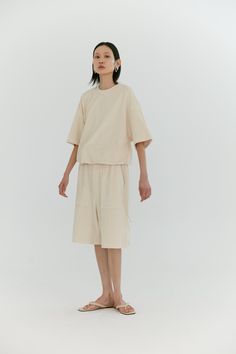 Our oversized t-shirt features a dropped shoulder and boxy silhouette. Trimmed with a tencel drawstring, this shirt can be worn relaxed or adjusted to fit a tucked in style. Made in our terry loop jersey this shirt is constructed inside out to feature the luscious texture on the exterior, then discreetly branded with our tonal monogram embroidery. Neutral Loungewear, Jersey Tshirt, Monogram Embroidery, Oversized Top, Comfy Fashion, Oversized T Shirt, Oversized Tee, Fashion Essentials, Women Dress