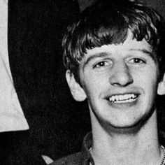 black and white photograph of young man smiling