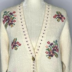 "Vintage LizSport Knit Cardigan Sweater M Cream Floral Embroidery Buttons V Neck Brand: LizSport Made in Korea Size M 100% Cotton Measurements: Chest: 20\" underarm to underarm Sleeve length: 22\" Length: 21\" from shoulder to hem Pre-owned Some color bleeding on some of the flowers and along the v-neck." Casual Cream Cardigan With Floral Embroidery, Spring Knit Cardigan With Fair Isle Pattern, Knit Fair Isle Pattern Cardigan For Spring, Spring Fair Isle Knit Cardigan, Beige Embroidered Cardigan, White Vintage Cardigan With Floral Embroidery, Beige Cardigan With Floral Embroidery For Fall, Beige Floral Embroidered Cardigan For Fall, Vintage Embroidered Cream Cardigan