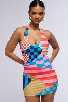 Get into the groove with the AKIRA Label Groovy Baby Printed Mini Dress. This funky little number is crafted from a super stretchy base fabrication and features a curve-hugging, bodycon silhouette with a halter neck, plunging v-neckline, light inner lining, and a bold, technicolor graphic print throughout. Style it with chunky earrings and platform boots and hit the dancefloor!   - 100% Polyester - Super Stretchy - Imported  (all measurements are approximate from a size small)  - 31” Neck to Hem - Model is 5'9" Product ID: 426302  (all measurements are approximate from a size 1X) - 34” Neck to Hem Product ID: 426300 Chunky Earrings, Baby Prints, Printed Mini Dress, Platform Boots, Halter Neck, Graphic Prints, Mini Dress, Boots, Fabric