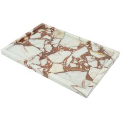 a white and brown marble serving tray on a white background with an orange stripe in the center