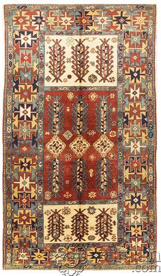 an old rug with many different colors and patterns